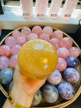 Load image into Gallery viewer, Moon Rituals - Radiant Honey Calcite Sphere | Natural Golden Yellow Calcite Crystal for Joy &amp; Confidence
