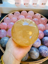 Load image into Gallery viewer, Moon Rituals - Radiant Honey Calcite Sphere | Natural Golden Yellow Calcite Crystal for Joy &amp; Confidence
